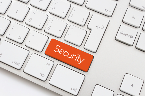 Security key on a white keybord - Shutterstock